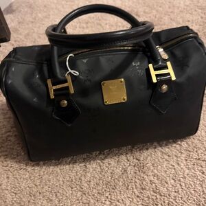 MCM Black Handbag with Gold Accents